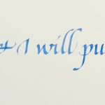 Quote in blue italic calligraphy with gold decoration